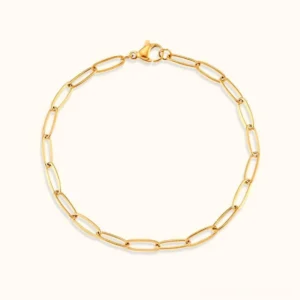 18K gold paperclip chain bracelet flat lay front view elegant oval link design