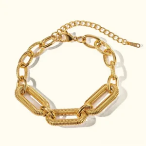 18K gold paperclip chain bracelet with textured oval links flat lay front view on white background showing detailed link design