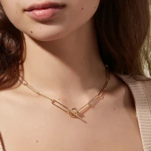 Gold paperclip chain choker necklace worn on model, close-up of OT toggle at neckline, hypoallergenic 18K gold jewelry