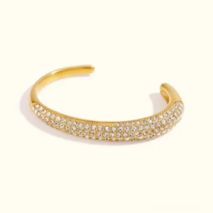 18K gold pavé crystal open cuff bracelet flat lay front view studio shot showcasing full sparkling crystal pave design