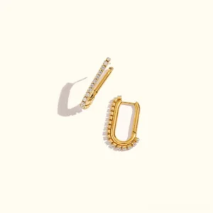 18K gold pavé huggie hoop earrings flat lay overhead view showing polished gold finish and cubic zirconia details