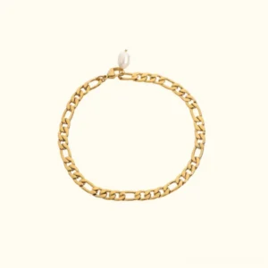 18K gold pearl anklet with teardrop freshwater pearl charm and delicate figaro chain on beige background flat lay