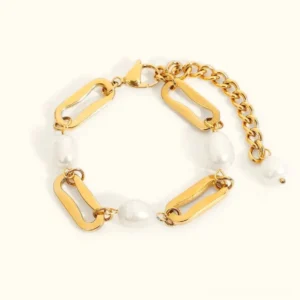 18K gold pearl chain bracelet flat lay with chunky paperclip gold links and baroque freshwater pearls on clean background