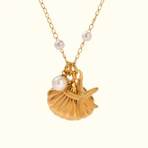 18K gold pearl seashell starfish necklace close-up front view with twisted chain on white background