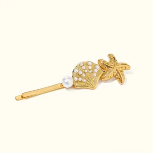 18K gold starfish shell bobby pin with faux pearl embossed design flat lay top view plain background