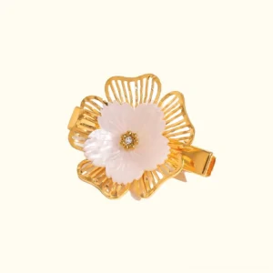 18K gold petal pearl hair clip front view with white freshwater pearl center and hollow gold petals on light background