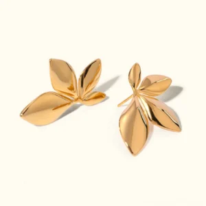 18K gold petal stud earrings overhead flat lay view on neutral background showing multi-leaf clustered floral design