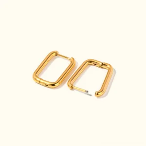 18K gold rectangular huggie earrings flat lay top-down view showing polished finish and hinged clasp mechanism