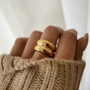 18K gold stackable ring worn on hand close-up chunky polished band casual minimalist style