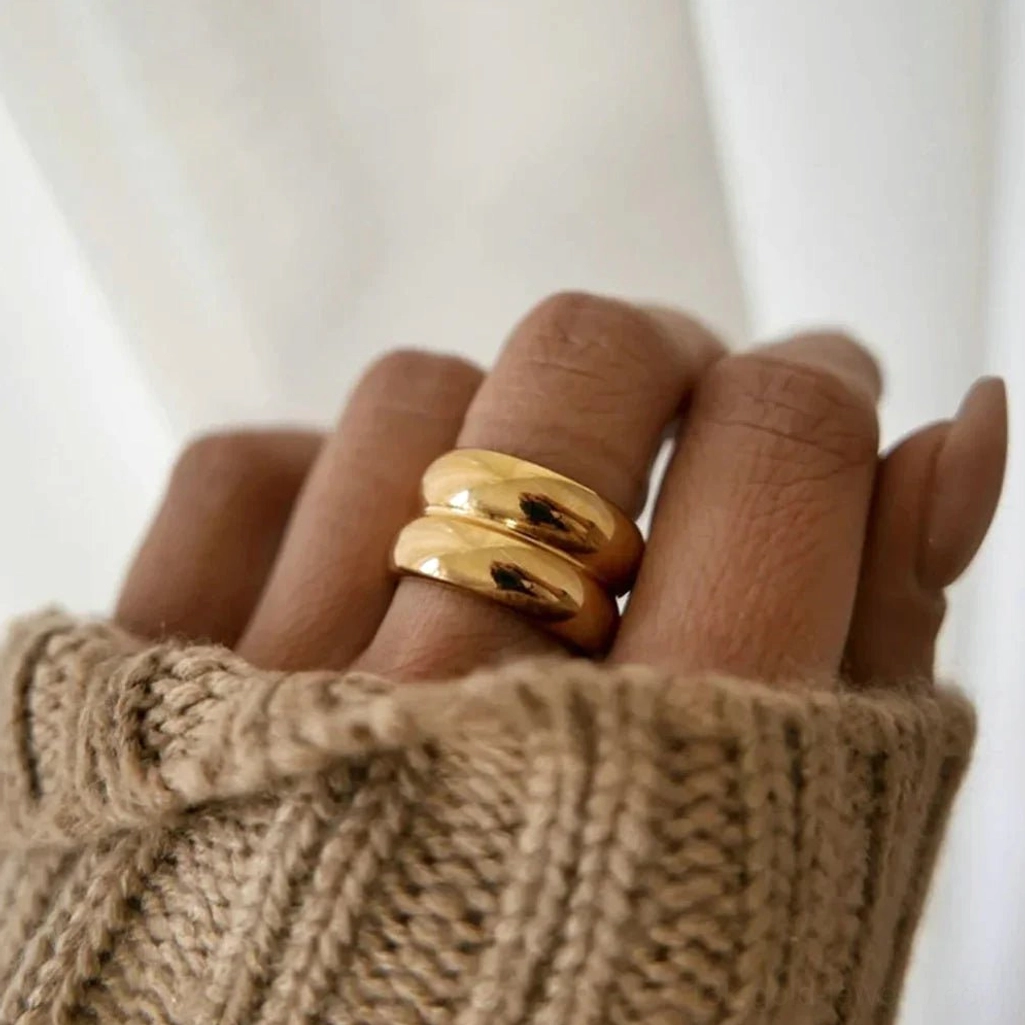 18K gold stackable ring worn on hand close-up chunky polished band casual minimalist style