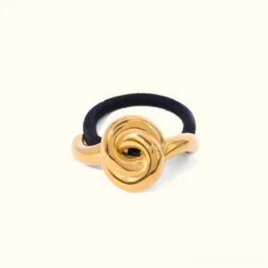 18K gold polished rose knot hair cuff with black elastic band front view