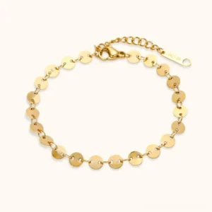 18K gold round disc chain bracelet top-down flat lay view showing delicate circular link design with adjustable extension tag