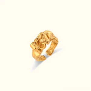 18K gold crumpled sculptural open cuff ring flat lay top view with irregular hammered texture on off-white background