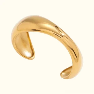 18K gold sculptural cuff bangle bracelet polished finish front view close-up studio shot open design