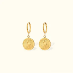 18K gold serpent coin drop earrings front flat lay view showing embossed snake motif and radial texture detail