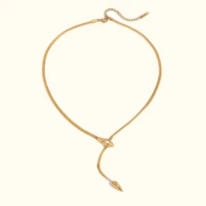 18K gold serpent lariat necklace with adjustable extender chain, featuring polished herringbone chain and snake head clasp with diamond simulant stone, front flat lay view on white background