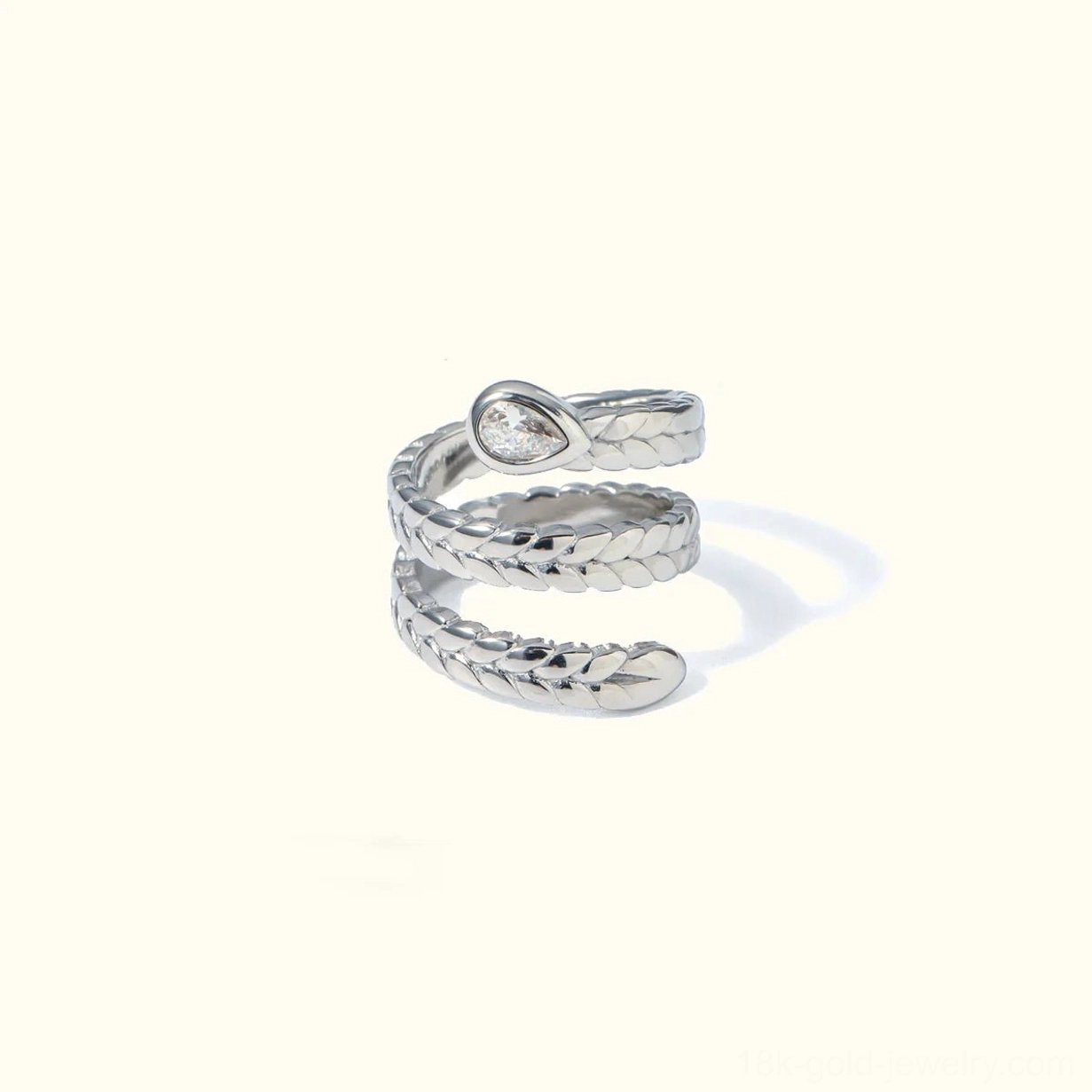 Silver serpent wrap ring front view three-layer coil scale texture with teardrop zircon accent