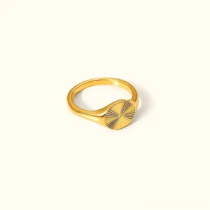 18K gold signet ring with sunburst textured face, flat lay frontal view on white background, warm gold tone