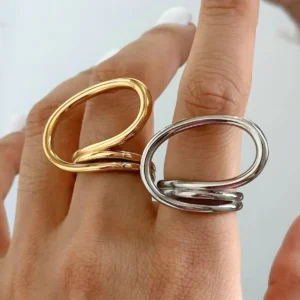 18K gold and silver dual-tone twisted open rings worn on model's hand first-person perspective showing real-life wear styling