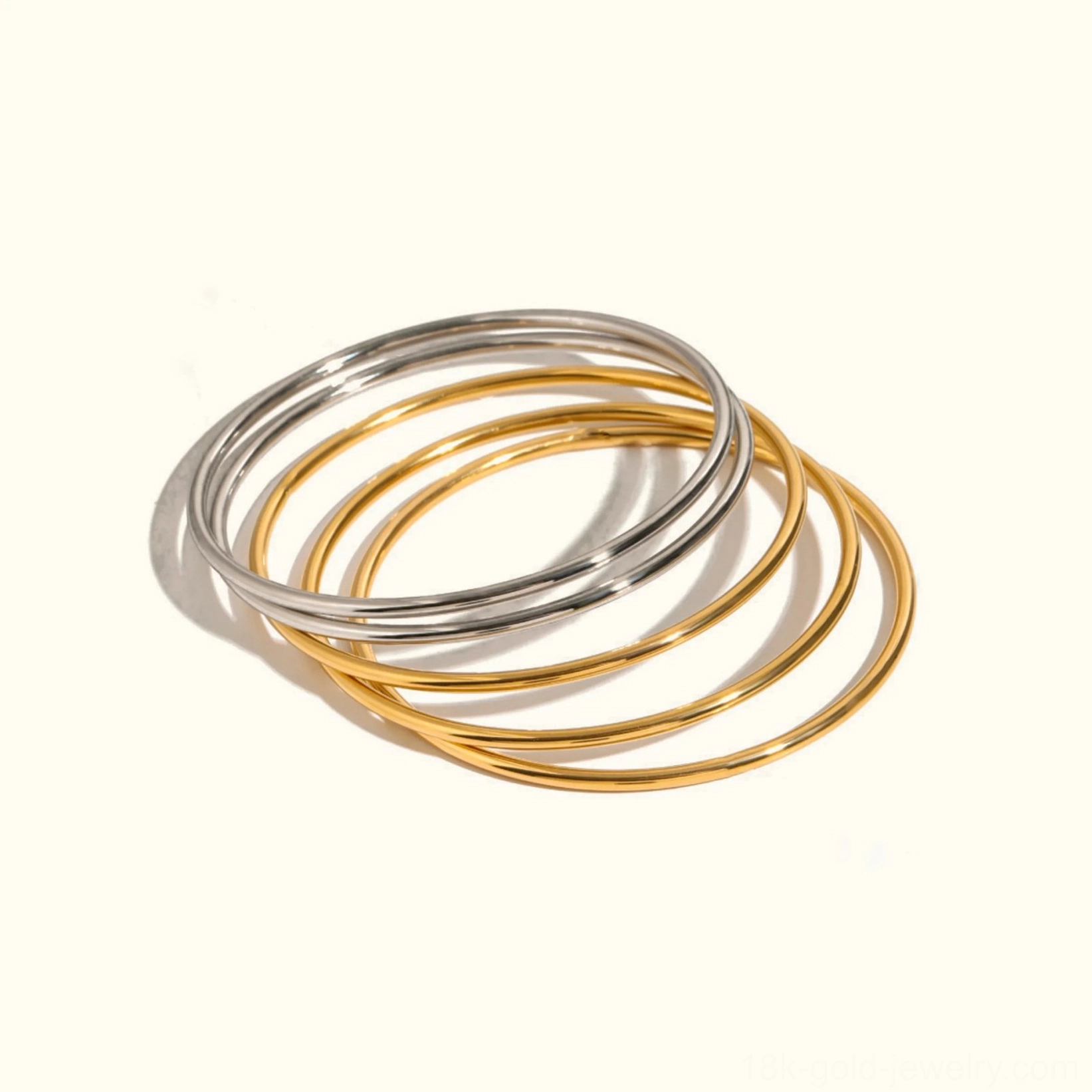 Mixed 18K gold and silver thin bangle set - two-tone stackable bracelets display