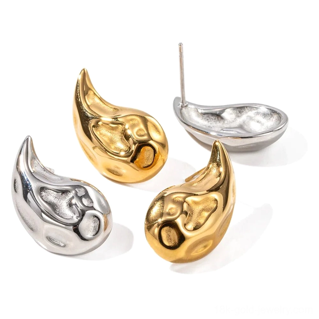 18K gold and silver teardrop stud earrings pair, top view showing ear posts and textured polished surface on white background