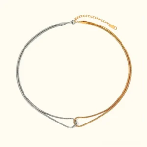 18K gold and silver two-tone snake chain necklace flat lay on white background showing dual interlocked chains