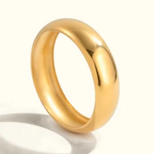 18K gold smooth bangle bracelet flat lay with polished finish front view white background