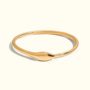 18K gold snake cuff bangle flat lay top view minimalist open design polished golden finish smooth snake head accent