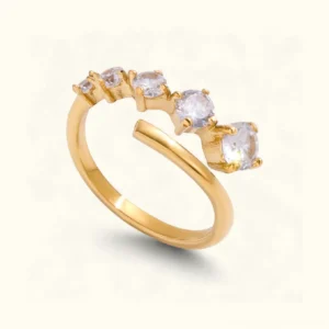 18K gold spiral diamond ring with graduated cubic zirconia stones front view on plain white background