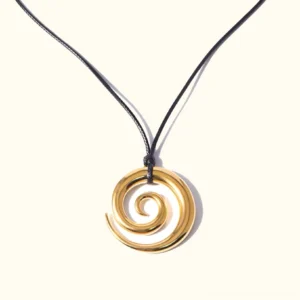 18K gold spiral pendant necklace with polished gold finish and black waxed cord on minimalist flat lay - front view product photography