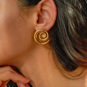 18K gold spiral stud earring worn on female ear close-up side view showing diamond sparkle