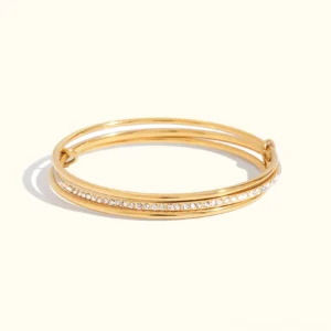 18K gold stacked diamond bracelet triple band flat lay front view neutral background