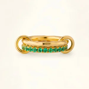18K gold stacked emerald ring with dual-layer gold bands and pavé green gemstone setting, frontal flat lay view showing luxury jewelry design