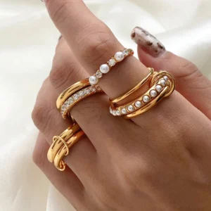 18K gold stacked ring worn on hand close-up styling with luxury fashion rings collection