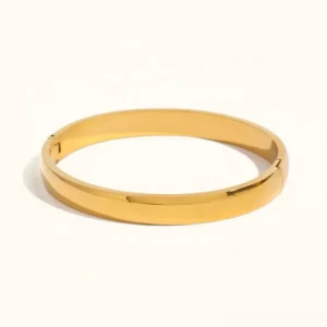 18K gold stacking bangle bracelet flat lay front view with polished hinged open design on white background