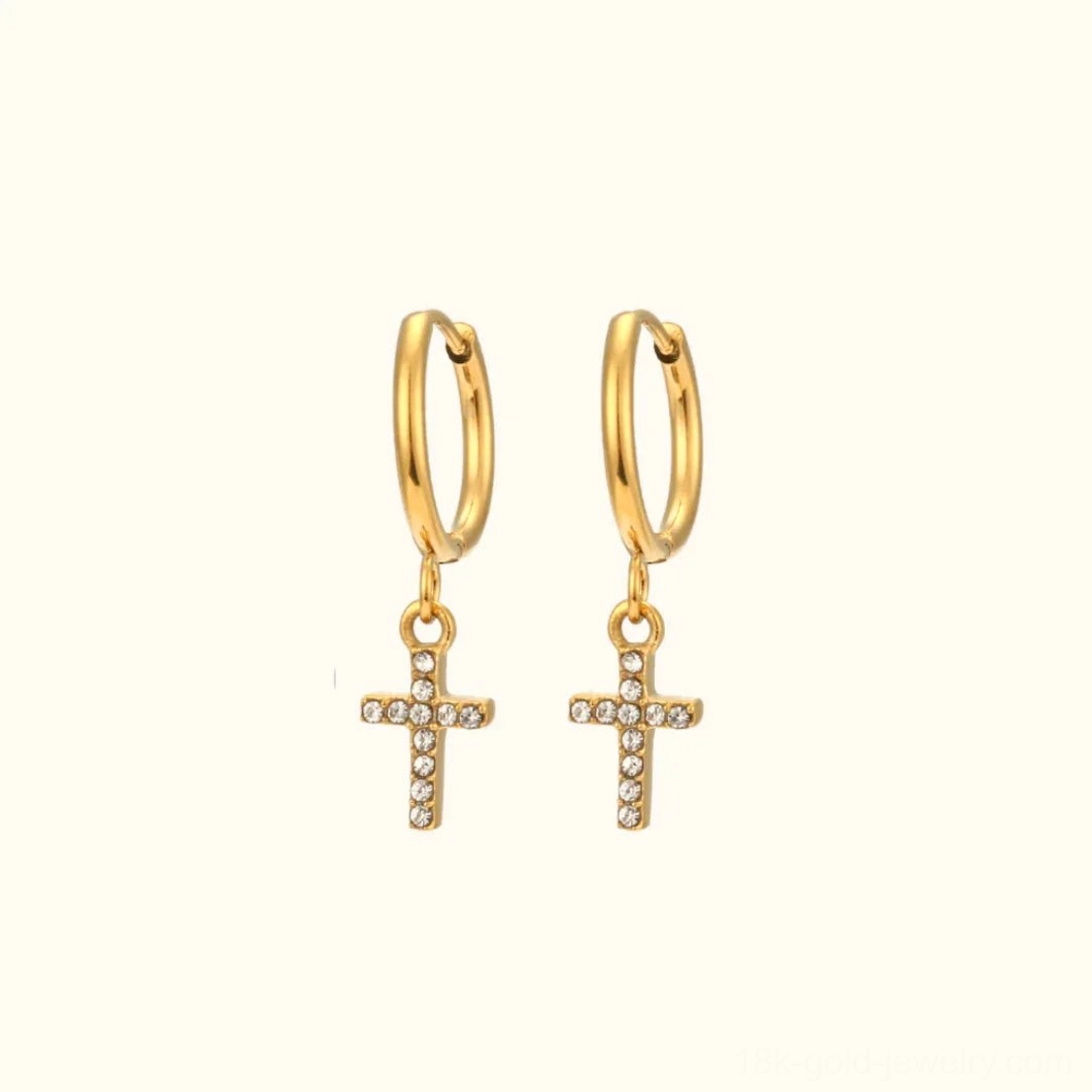 18K gold star charm huggie hoop earrings with cubic zirconia starburst design flat lay