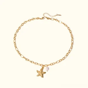 18K gold starfish pearl necklace flat lay front view, figaro chain with freshwater pearl and starfish pendant on plain background