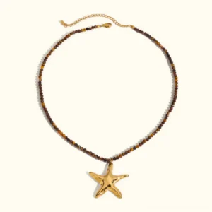 18K gold starfish pendant beaded necklace flat lay view with brown faceted beads and lobster clasp on white background