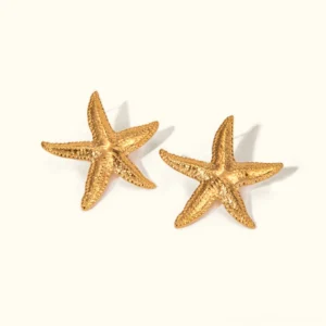18K gold starfish stud earrings pair flat lay with textured ridged design on white background