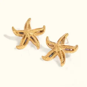 18K gold starfish stud earrings flat lay, hollow textured design with iridescent shell details on white background, product photography