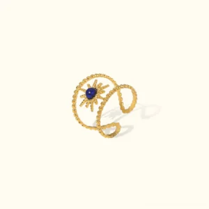 18K gold sun ring with blue stone, adjustable open design, flat lay on plain beige background, twisted gold bands with central gemstone
