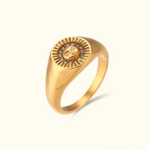 18K gold sunface ring with CZ crystals, three-quarter top view showcasing the radiant sun face motif and sparkling diamond simulants