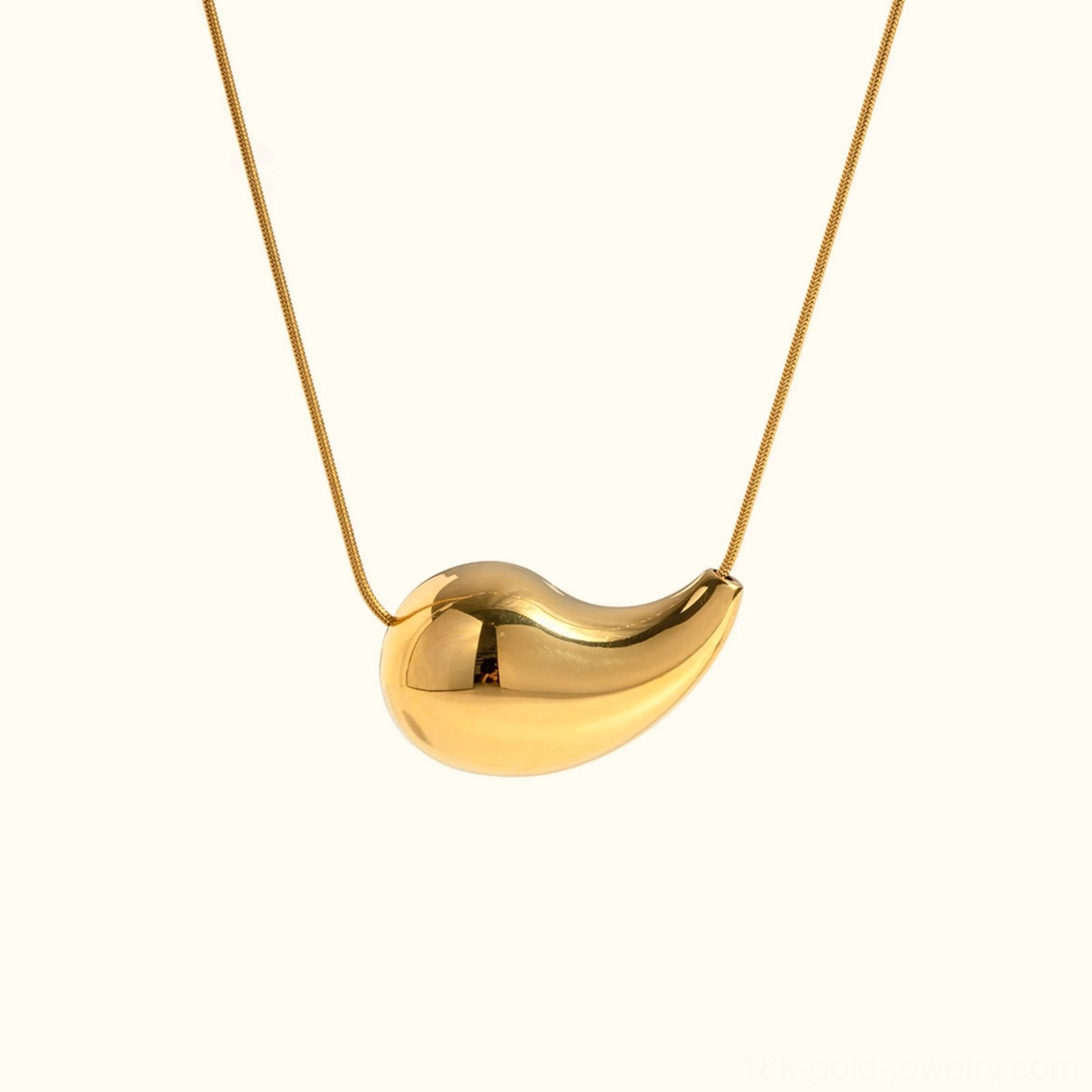 18K gold teardrop drop necklace front view - polished gold pendant on delicate snake chain against plain background