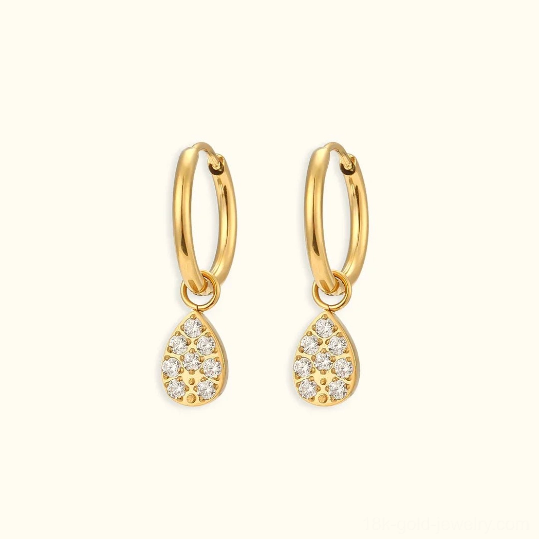 18K gold teardrop pendant huggie hoop earrings with pavé cubic zirconia flat lay front view