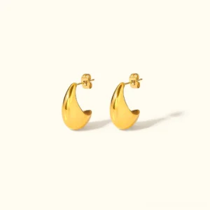 18K gold teardrop stud earrings flat lay front view on off-white background, polished gold curved design