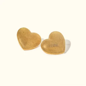 18K gold textured heart stud earrings top-down flat lay view with woven mesh surface detail on off-white background