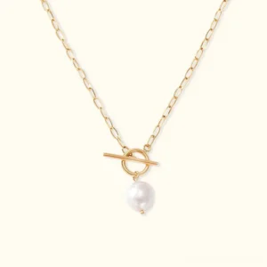 18K gold toggle freshwater pearl necklace flat lay with paperclip chain and T-bar clasp on neutral background