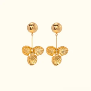 18K gold trillium drop earrings front view flat lay polished gold ball stud with ridged three-petal flower pendant on neutral studio background