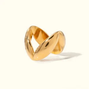 18K gold twisted chunky ring with polished interwoven band design, front view flat lay on neutral studio backdrop