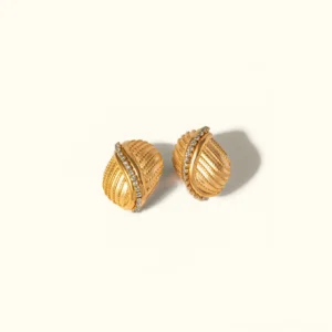 18K gold twisted stud earrings with crystal accents flat lay view premium luxury jewelry